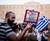 A protestor outside the Greek parliament building on 29 June 2015, holding a sign reading. By Jan Wellman.