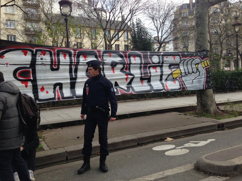 A policeman stands guard by Boulevard Saint Sebastian in Paris before the march on Sunday.